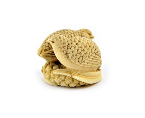 A Japanese ivory netsuke, 19th century, carved as two quail seated on millet, each bird with inlaid eyes, signed Okatomo, 4cm