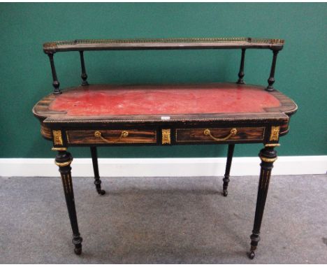 A 19th century gilt metal mounted coromandel writing desk, the galleried shelf back over a rounded rectangular plateau and tw