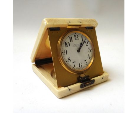 An ivory cased travel eight day clock, the dial detailed J.C. Vickery 9.5cm high. 