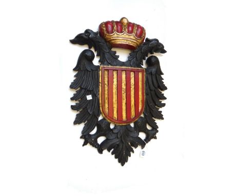 A modern polychrome carved wooden wall panel detailed as a Prussian heraldic crest (60cm high), a modern carved hardwood phot