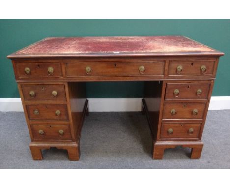 A 19th century mahogany pedestal desk, with nine drawers about the knee, on bracket feet, 120cm wide.