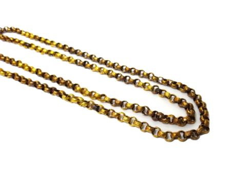 A gold circular link long chain, the circular links decorated with stars, on a beaded ground, on a gold cylindrical clasp wit