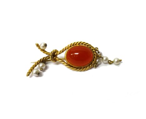 A cornelian and cultured pearl brooch, mounted with an oval cornelian, within a ropetwist surround and with seven cultured pe