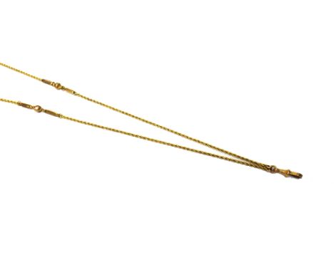 A gold ropetwist link long chain, with twin bar and faceted bead divisions at intervals, detailed 9 C, the front fitted with 