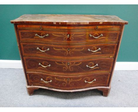 A 19th century marquetry inlaid mahogany serpentine chest, the brushing slide over four long graduated drawers on bracket fee