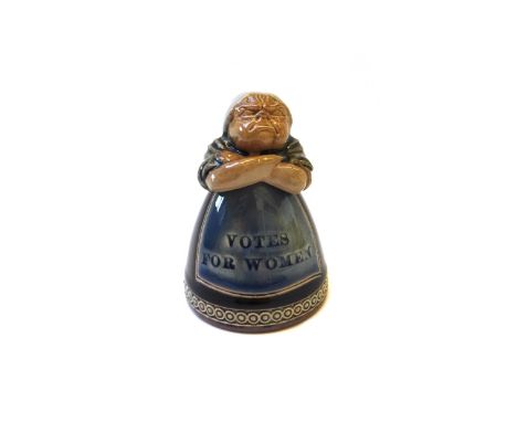 A Royal Doulton stoneware novelty inkwell, 'Votes for Women', early 20th century, modelled as an angry woman with arms folded
