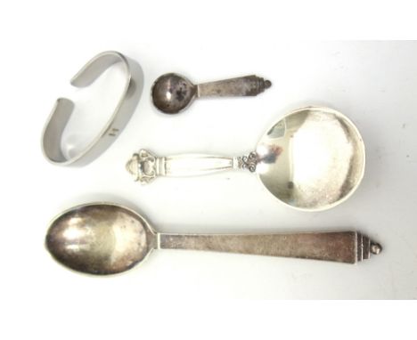 A Georg Jensen silver tea caddy spoon, detailed Sterling Denmark, import mark London 1938, a Georg Jensen Sterling christenin