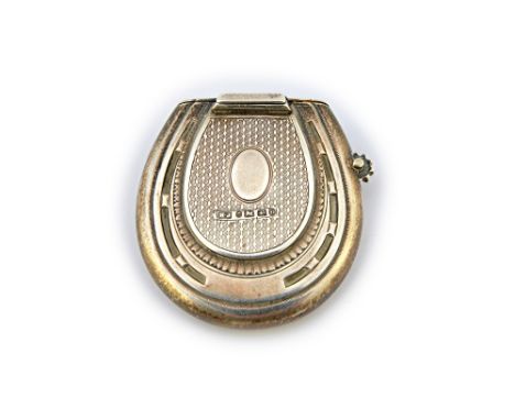 A Victorian silver vesta case cum lighter, of horseshoe form to both sides, the centre engine turned and with a vacant oval c