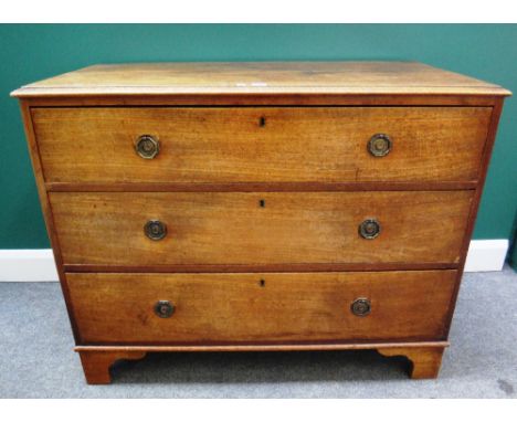 A George III mahogany chest of three long graduated drawers, on bracket feet, 110cm wide.