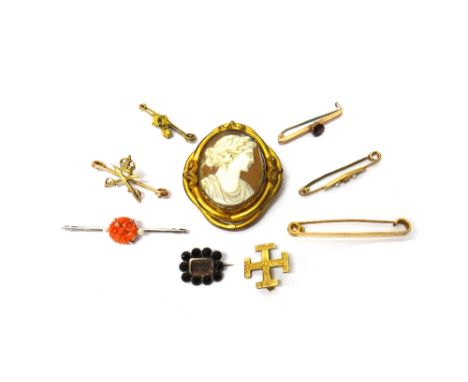 A white gold, carved coral and seed pearl set bar brooch, with floral motifs, a gold bar brooch, claw set with a circular cut