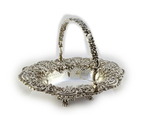 A George IV silver swing-handled basket by Robert Gainsford, Sheffield 1824, shaped oval form, the sides die-stamped with hig
