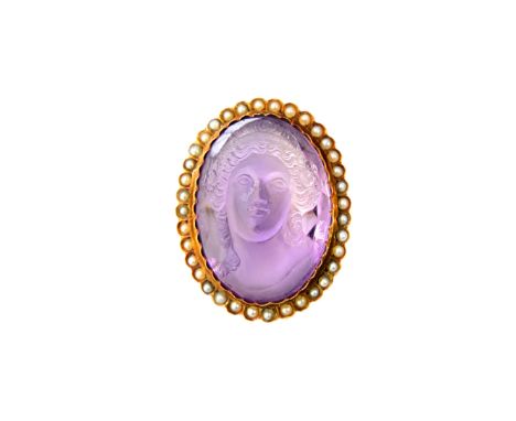 A gold, carved amethyst cameo and seed pearl set brooch, the oval carved amethyst cameo designed as the portrait of a lady, w