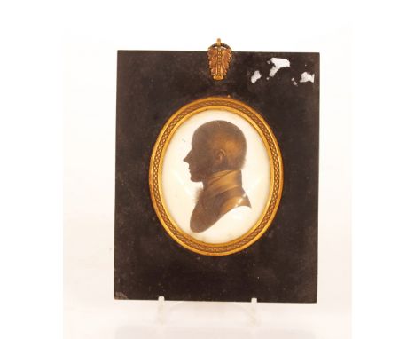 A pair of early 19th Century silhouette portrait&nbsp;profiles,&nbsp;in ebonised and brass mounted frames of a lady and gentl