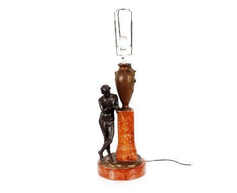 A French bronze and marble lamp,&nbsp;decorated with semi-naked boy playing a pipe reclining against a column with urn aloft,