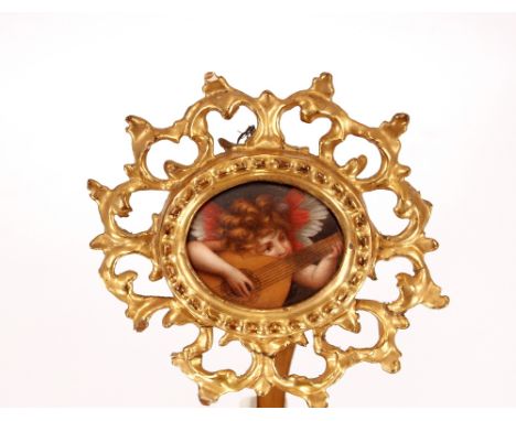 A 19th Century Italian miniature painting,&nbsp;on porcelain depicting a cherub with a lute in gilt Florentine easel frame, p