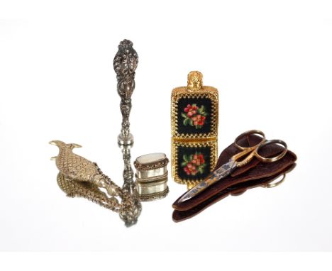 A white metal handled seal;&nbsp;a white metal scent flask in the form of a fish; a white metal pill box with mother of pearl