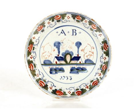 A rare 18th Century Bristol Delftware polychrome plate,&nbsp;naively painted with initials A.B. dated 1733 above and below co