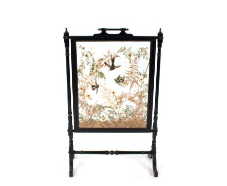 A late Victorian ebonised taxidermy worked firescreen,&nbsp;96cm high x 64cm wide