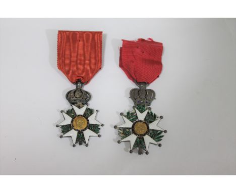 LEGION D'HONNEUR. A Legion d'Honneur award with red ribbon on a ring suspension and crown decorated with eagles with wings ou