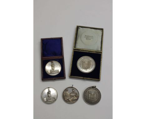 SILVER RATHMINES SCHOOL etc PRIZE MEDALS. 1. A cased silver Trinity College Dublin medal, 51mm diameter. No provision for a m