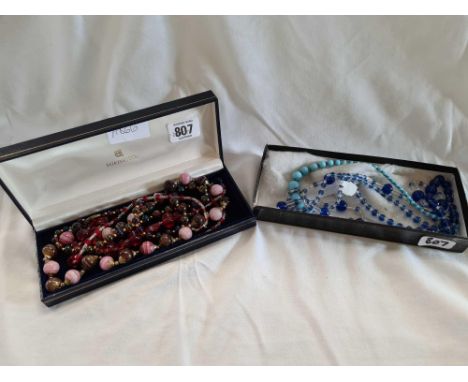 SMALL CARTON OF BLUE STONE NECKLACES &amp; A JEWELLERY BOX OF RED COLOURED STONED NECKLACES