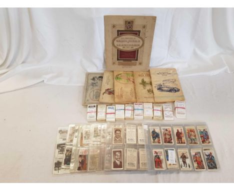 CARTON OF CIGARETTE CARDS IN ALBUMS, TRAMS, VETERAN CARS, DANGEROUS ANIMALS, HISTORY OF NAVAL DRESS, WAR CARTOONS, KINGS OF S