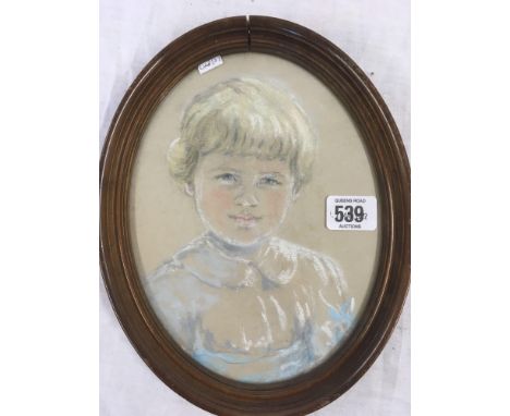 OVAL PASTEL PORTRAIT OF A LITTLE GIRL.