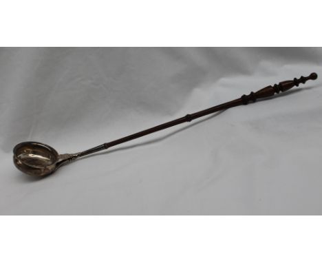 A Victorian silver ladle with a turned fruitwood handle, Birmingham, 1871, 44.5cm long