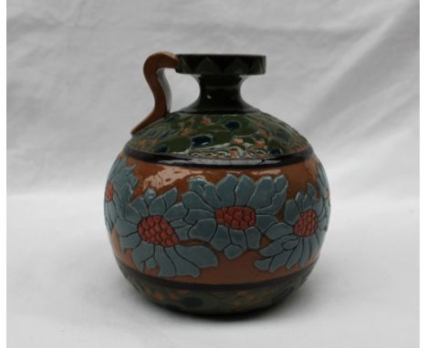A Wileman &amp; Co Foley "Urbato" pattern pottery jug, decorated with raised flower heads and leaves to a brown ground, Rd.No