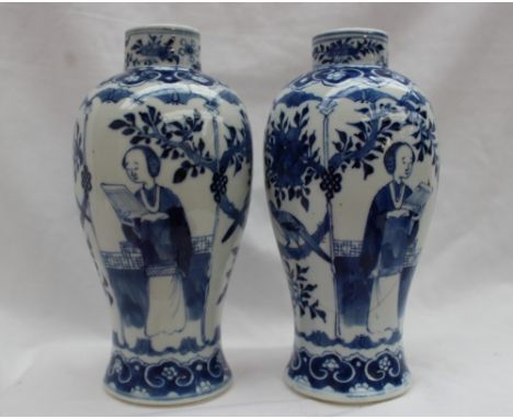 A pair of Chinese blue and white porcelain vases of inverted baluster form, painted with panels of a figure reading and a bir