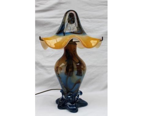 A Bernard Aconito for Biot, French glass table lamp the domed glass shade in yellows and blue above a baluster body in swirli