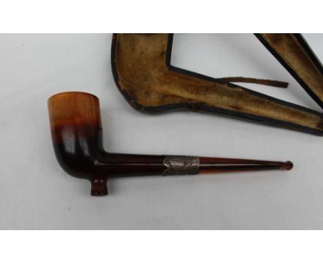 A Meerschaum pipe, with a silver collar and amber mouth piece, cased