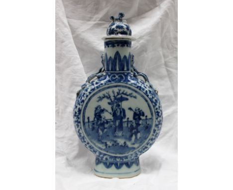 A Chinese blue and white porcelain moonflask, the domed finial with a dog of foo terminal, and leaves, the body decorated wit