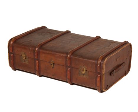 A KOFFER WINKLER WIEN TRAVELLING TRUNK
A brown canvas travelling trunk with wooden and brass detailing, Koffer Winkler Wien p