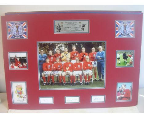 England 1966 World Cup Team Fully Signed Display: Measuring a massive 23 x 33 inches and double mounted in red and blue with 