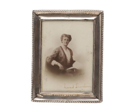 Maud Petty-Fitzmaurice, Marchioness of Lansdowne. A postcard photograph portrait, the subject seated with book rested on her 