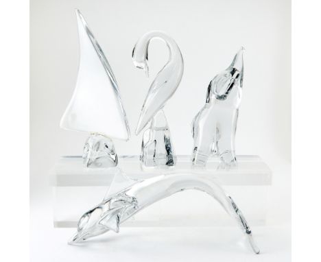 Comprising a dolphin figure, elephant figure (with raised trunk), sailboat, and a bird figure (egret or heron or swan), in co
