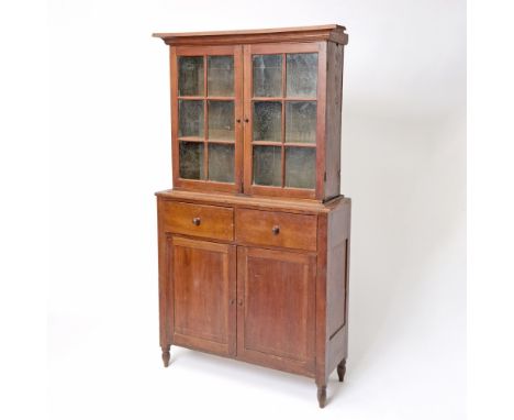 Possibly Southern United States, early 19th centuryWith cove molded cornice above glazed doors on lower section with two deep