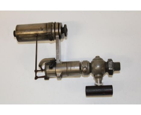 A vintage steam engine steam pressure tester 