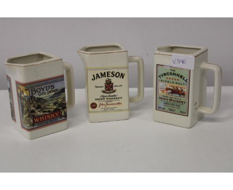 Three collectable vintage whisky water jugs 