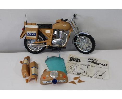 A vintage Action man police motor cycle (as found) 