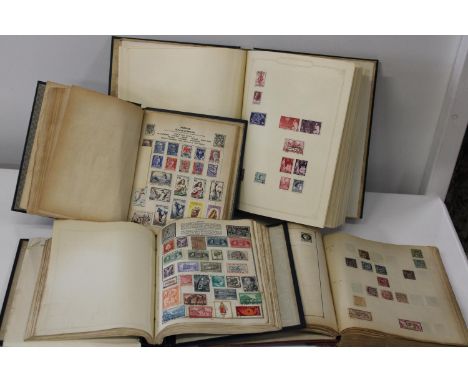 Four vintage stamp albums 