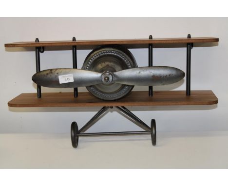 A novelty model airplane wall mount item 
