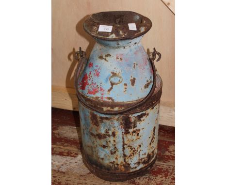 A vintage metal milk churn 