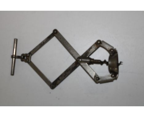 A vintage scissor movement corkscrew 