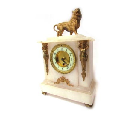A late 19thC alabaster and ormolu mantel clock, the top with a roaring lion, with a circular cream numeric dial, with Medusa 