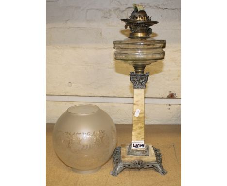 A neo classical Victorian oil lamp with an etched shade. 