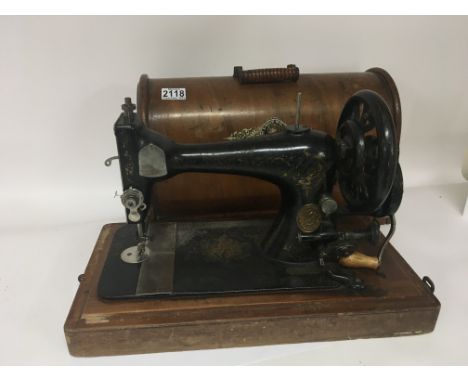 A Vintage cased singer sewing machine.