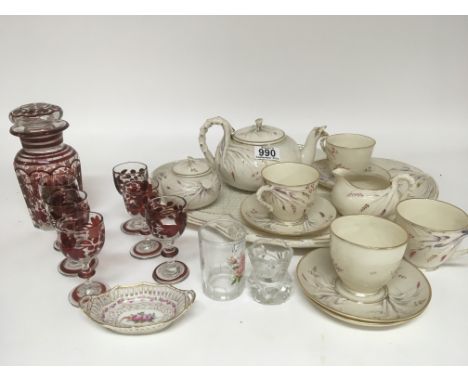 A First Period 1863-1890 Belleek porcelain part tea set with four cups and saucers a tray tea pot and sugar bowl tray some da