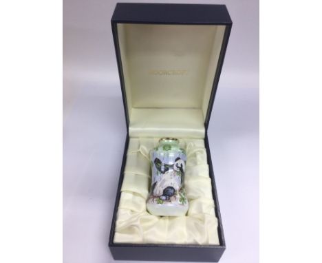 A small boxed Moorcroft enamel vase depicting pandas, approx 8cm. Shipping category D.